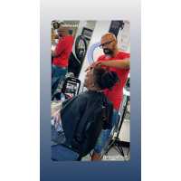 Reggie's Barbershop and Salon Logo